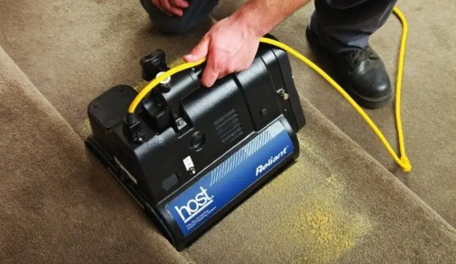 _BA8F063A-643C-427E-AD10-874752F94A69_ 2 men using carpet cleaning machine